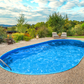 Stålvægspool Ibiza Oval 3,50 × 7,00 × 1,20 m 0,6 mm med blå topskinner P1/P3 og bundskinner, med hul til skimmer og indløb